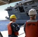 Sailors stand by as the aircraft carrier USS Harry S. Truman (CVN 75) arrives at Naval Support Activity Souda Bay