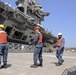 Sailors handle lines as the aircraft carrier USS Harry S. Truman (CVN 75) arrives at Naval Support Activity Souda Bay