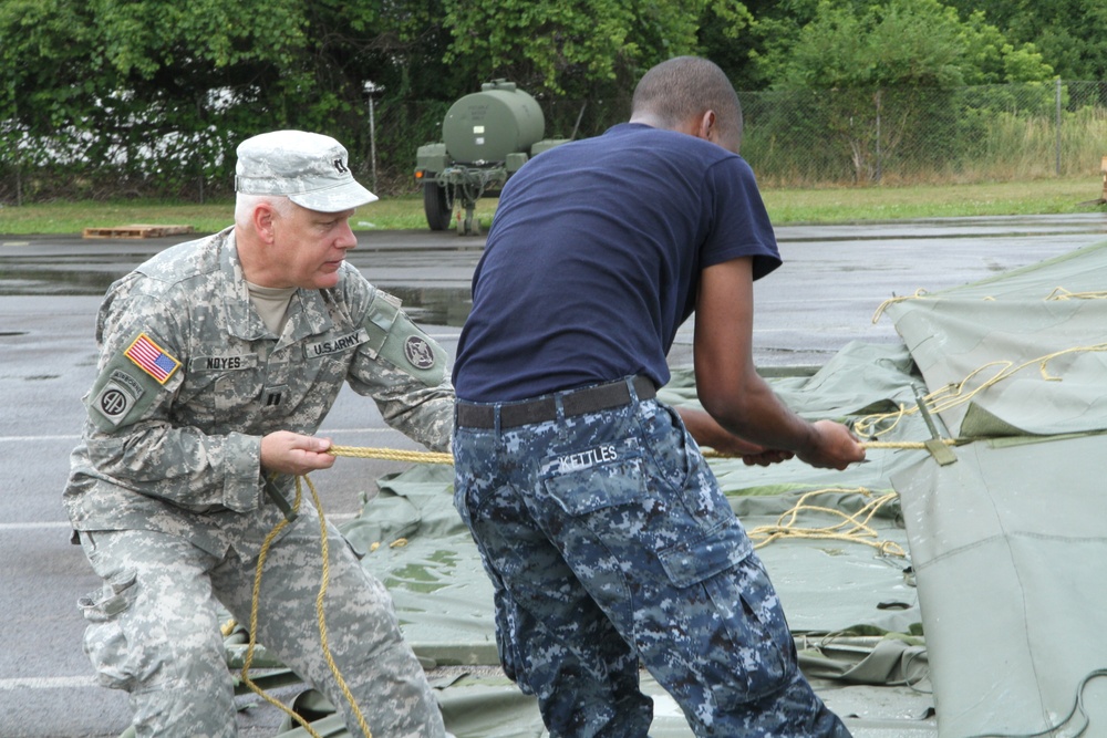 Service members prepare tents for IRT event in Cortland, NY.