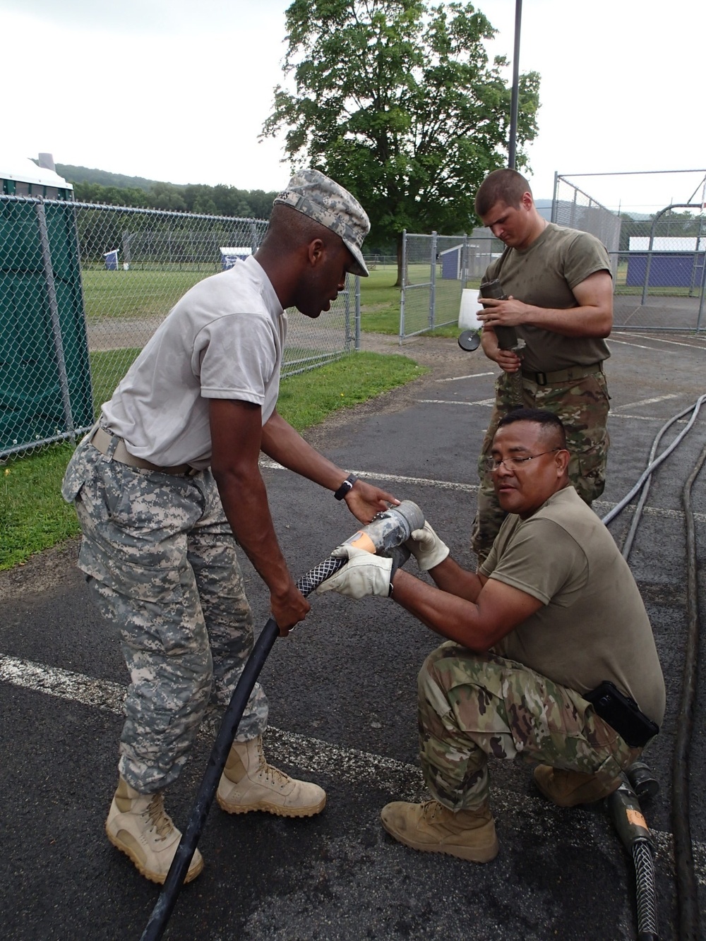 Service members connect electrical equipment for IRT event in Norwich, NY.