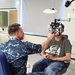 Service member provides eye care during the IRT Event in Norwich, NY
