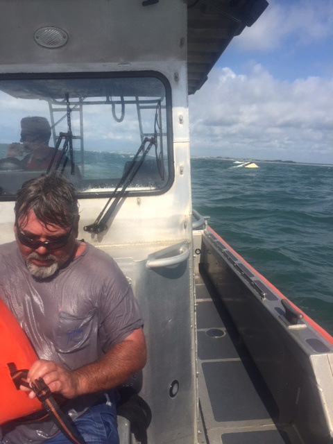 Rough waters, smooth rescue: Coast Guard pulls two men from Bogue Inlet after their boat capsizes