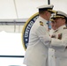 Capt. Anthony Ceraolo and Capt. Greg Stump hug during a change of command ceremony