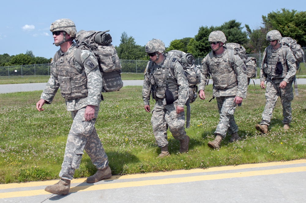 Soldiers Walk Onto Flight Line