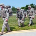 Soldiers Walk Onto Flight Line