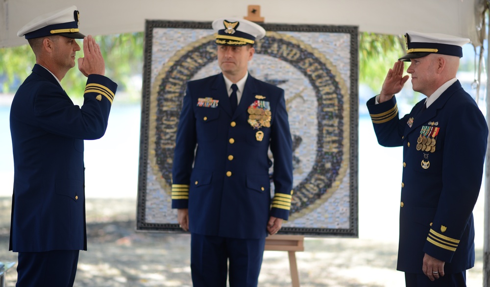 Lt. Cmdr. Lawrence F. Ahlin and Lt. Cmdr. Christopher A. White salute during a change of command ceremony