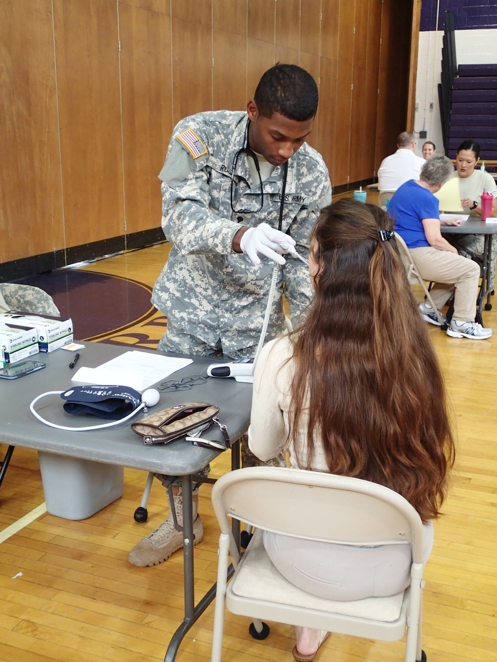 Service member takes vital signs during IRT event in Norwich, N.Y.