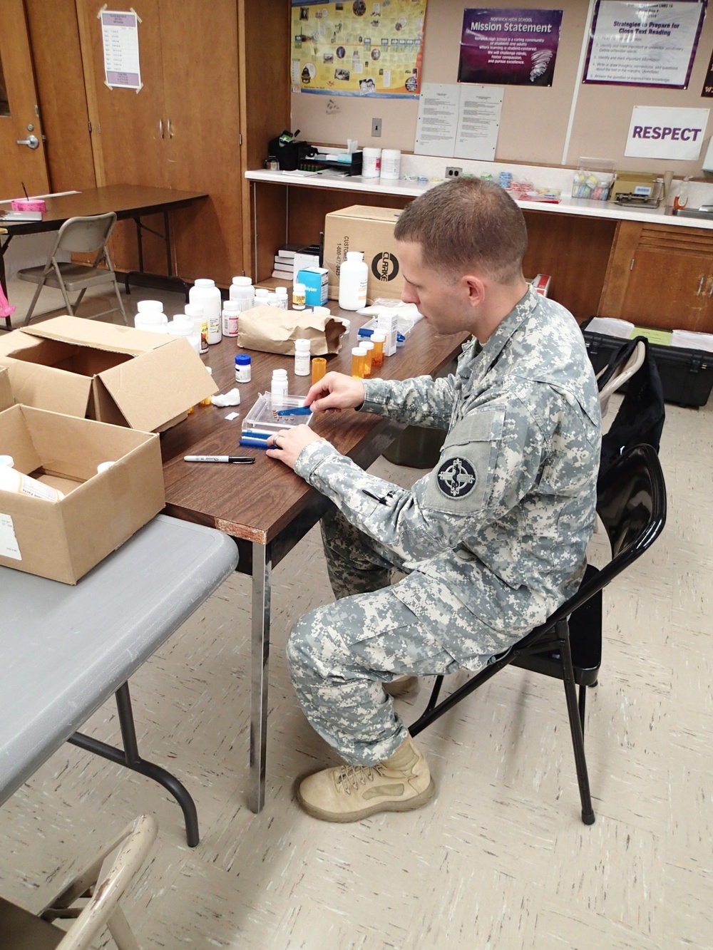 Pharmacy tech dispenses medications during IRT event in Norwich, N.Y.