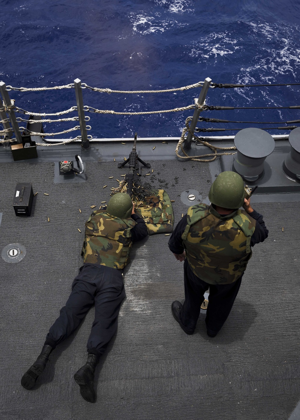 USS Shoup Sailors fire M240 machine gun