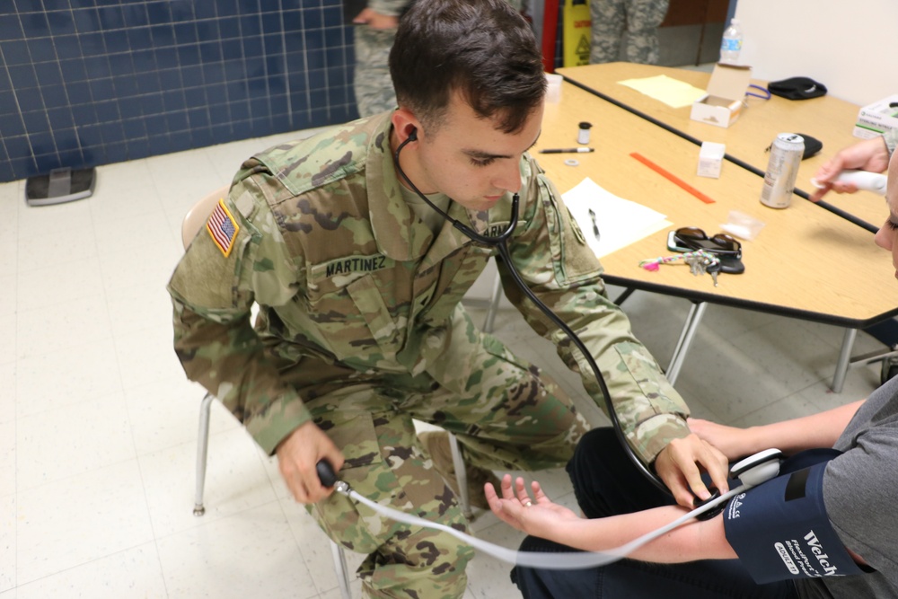 Service members provide medical care during IRT event in Homer, N.Y.