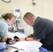 Service members provide veterinary services for the IRT event in Norwich, N.Y.