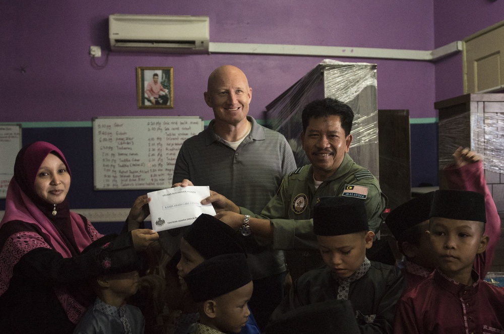 U.S. and Malaysian Airmen give back