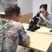 Service member checks glasses prescription during IRT event in Norwich, N.Y.