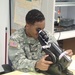 Service members check glasses prescription.