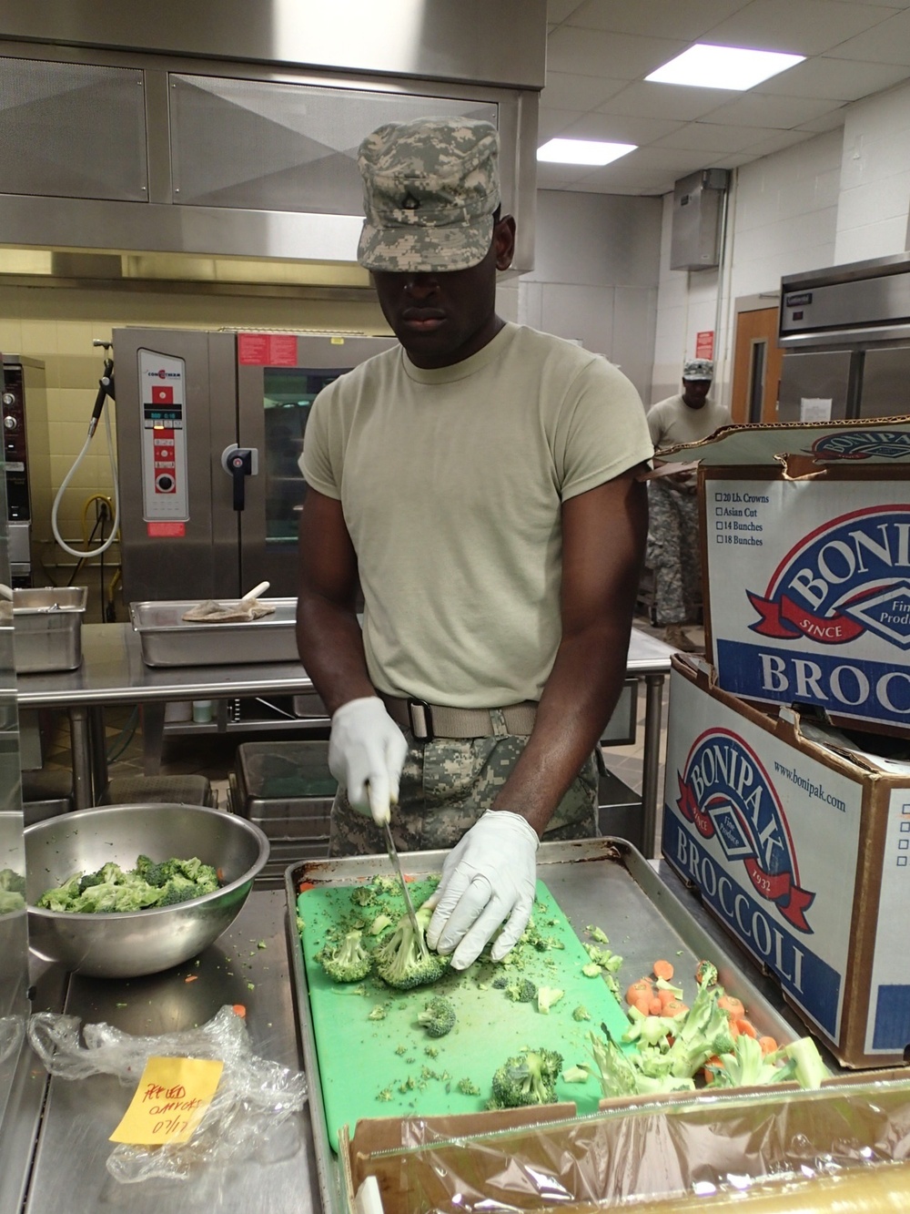 Soldier prepares evening meal.