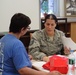 Airman provides medical information to community member in Norwich, N.Y.