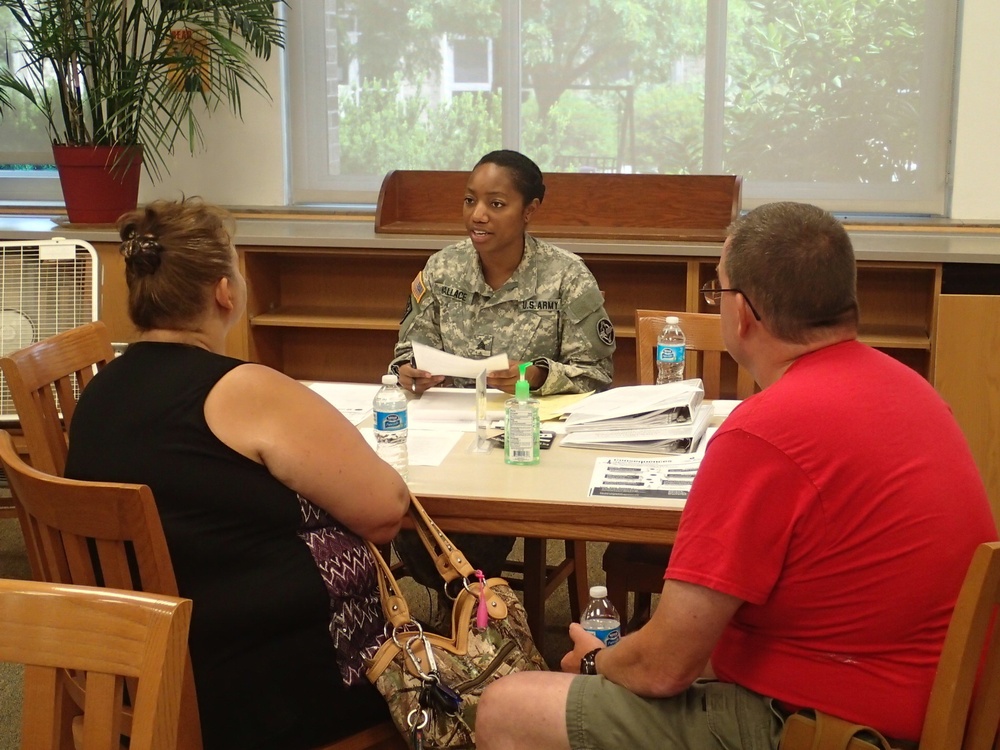 Soldier provides medical information to community member in Norwich, N.Y.