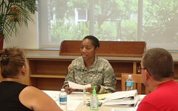 Soldier provides medical information to community member in Norwich, N.Y.