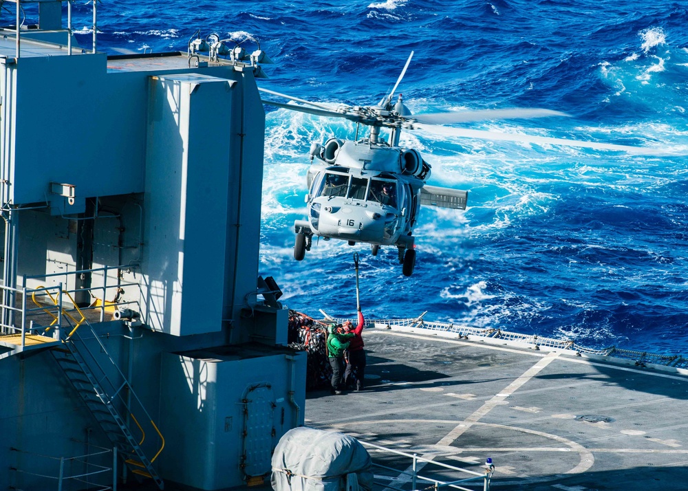 USS John C. Stennis (CVN 74) conducts a replenishment at sea with USNS Rainier (T-AOE 7) during RIMPAC