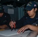 USS John C. Stennis (CVN 74) Sailors plat ships courses during RIMPAC