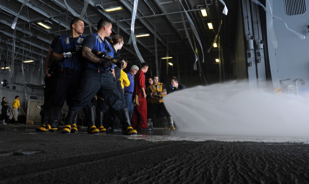 Air department Sailors conduct an aqueous film forming foam (AFFF) system test in the hangar bay of the aircraft carrier USS George H.W. Bush (CVN 77). GHWB is conducting sea trials to complete a planned incremental availability. After completion she will