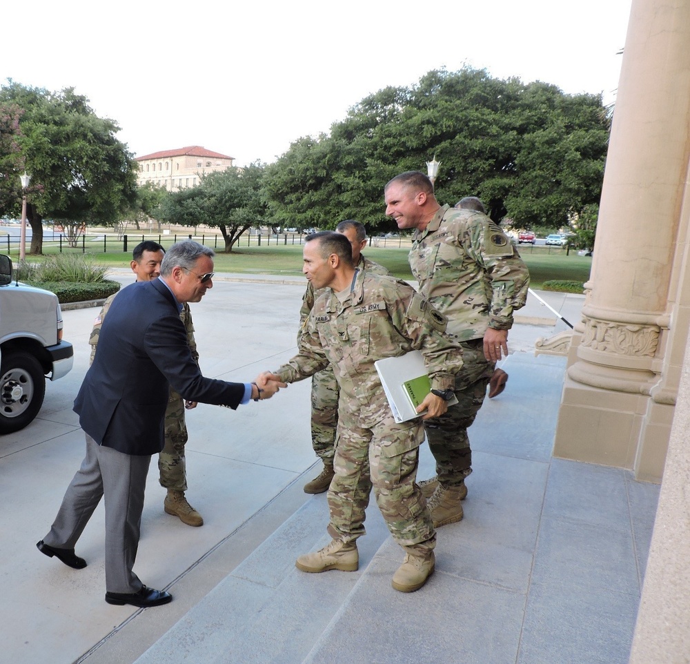 Col. Rafael Paredes, Deputy Chief of Operations, U.S. Army South, exchanges greetings with U.S. Ambassador to Panama, John D. Feeley, upon the ambassador’s arrival at Army South headquarters.