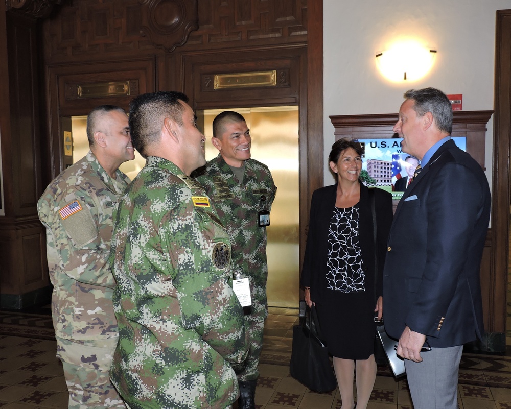 U.S. Ambassador to Panama, John D. Feeley, and Dr. Bridget Gersten, the State Department's Foreign Policy/Political Advisor assigned to U.S. Army South, converse with U.S. Army South Partner Nation Liaison Officers.