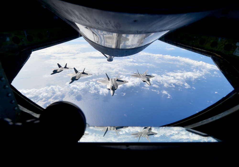 KC-135R Stratotanker refuels F-22 Raptors at RIMPAC