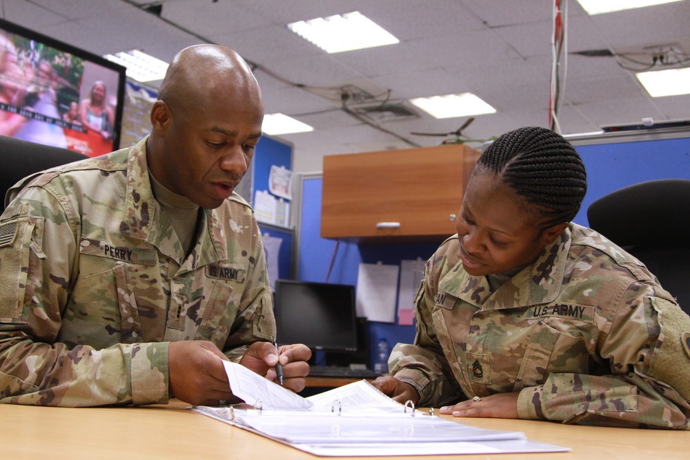 Soldiers review warrant officer packet