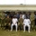Crisis Response Marines conduct Intelligence training with Ghanaian Forces. A formal military group photograph featuring personnel from multiple nations in various uniforms, posed in front of a single-story white building. The group includes individuals in US Marine Corps camouflage, US Navy uniforms, and what appear to be West African military/police uniforms in light blue and dark navy. Senior officers are seated in the front row while junior personnel stand in rows behind them.