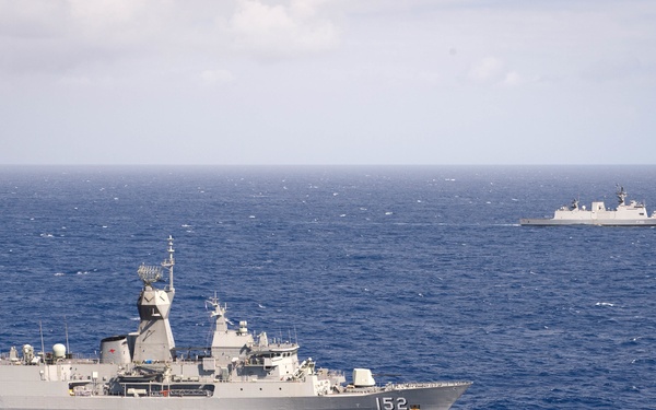 Forty Ships and Submarines Steam in Close Formation During RIMPAC - HMAS Warramunga (FFH 152) and INS Satpura (F48)