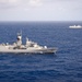 Forty Ships and Submarines Steam in Close Formation During RIMPAC - HMAS Warramunga (FFH 152) and INS Satpura (F48)
