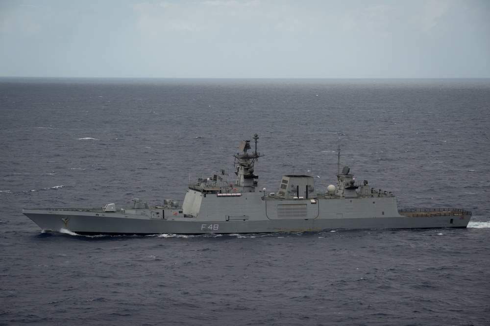 Forty Ships and Submarines Steam in Close Formation During RIMPAC - INS Satpura (F48)