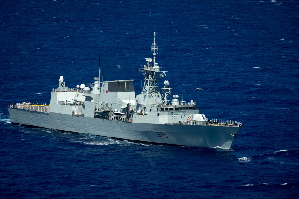 Forty Ships and Submarines Steam in Close Formation During RIMPAC - HMCS Calgary (FF 335)