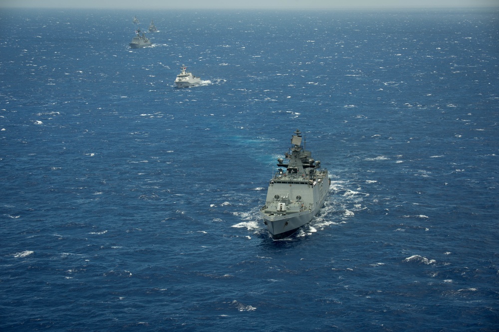 Forty Ships and Submarines Steam in Close Formation During RIMPAC - INS Satpura (F48)