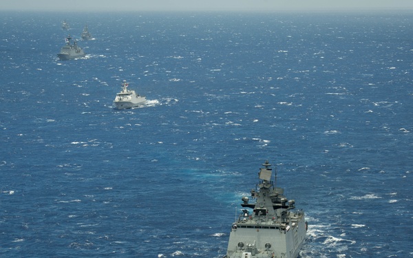 Forty Ships and Submarines Steam in Close Formation During RIMPAC - INS Satpura (F48)