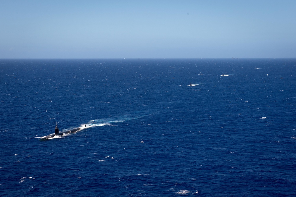 Forty Ships and Submarines Steam in Close Formation During RIMPAC - USS Cheyenne (SSN 773), ROKS Lee Eokgi (SS 071) USS Tucson (SSN 770) and USS Santa Fe (SSN 763)