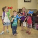 Kailyn Sobey, 6, Levi Sobey, 3, children of Michelle and CW3 Ben Sobey, an Army helicopter pilot, and Madison Roselli, 6, along with Mason Roselli, 4, children of Amanda and 1st Sgt Neil Roselli, play with their baloon art together during the Back to Scho