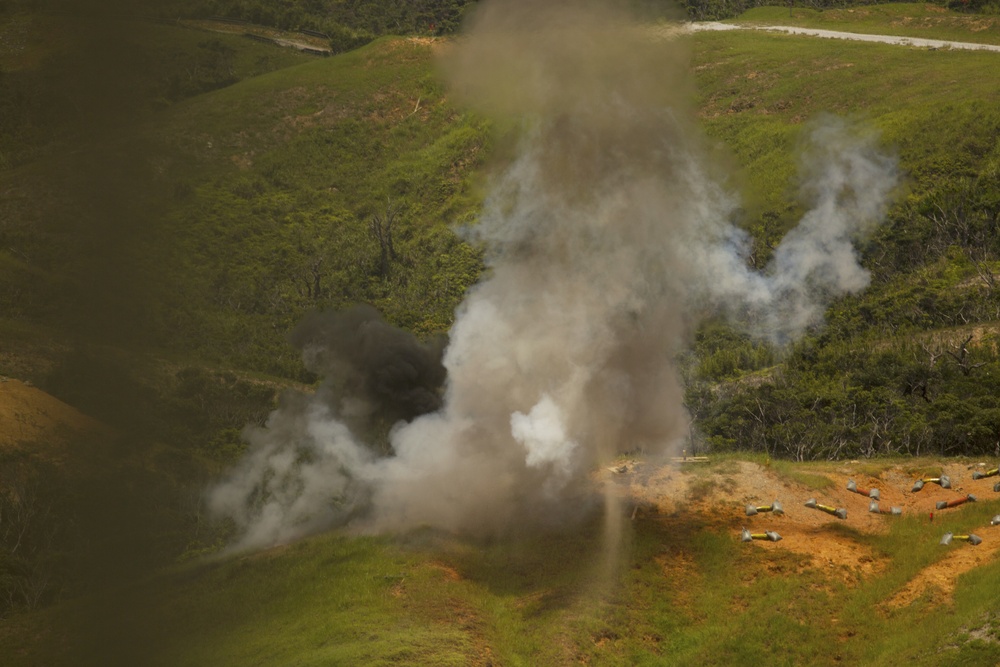 Explosive Ordnance Disposal technicians, reconnaissance Marines practice standoff munitions disruption