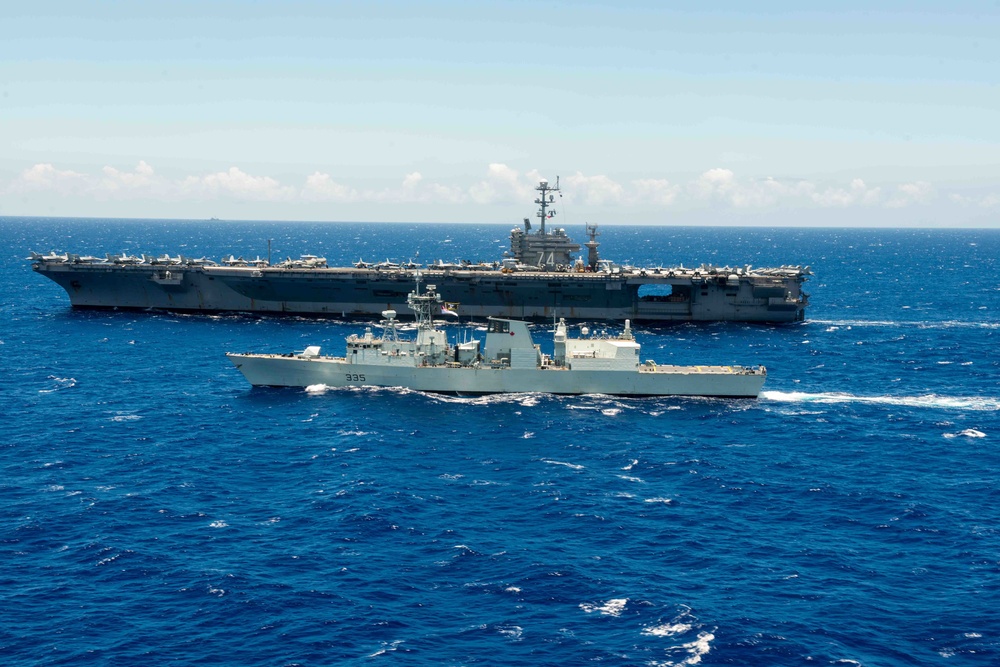 USS John C. Stennis (CVN 74) and HMCS Calgary (FF 335) Underway during RIMPAC