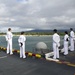 USS America mans the rails while pulling in to Pearl Harbor