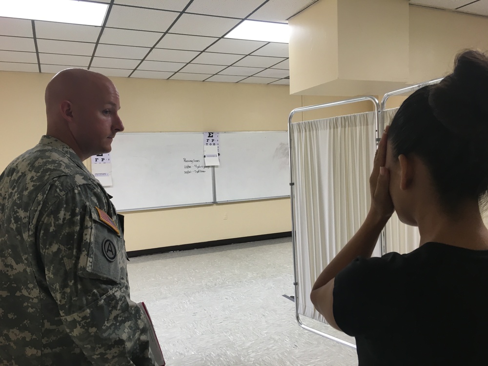 Army Reserve Soldier provides medical support with patient during Operation Lone Star