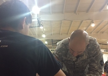 Army Reserve Soldier assists patient during Operation Lone Star