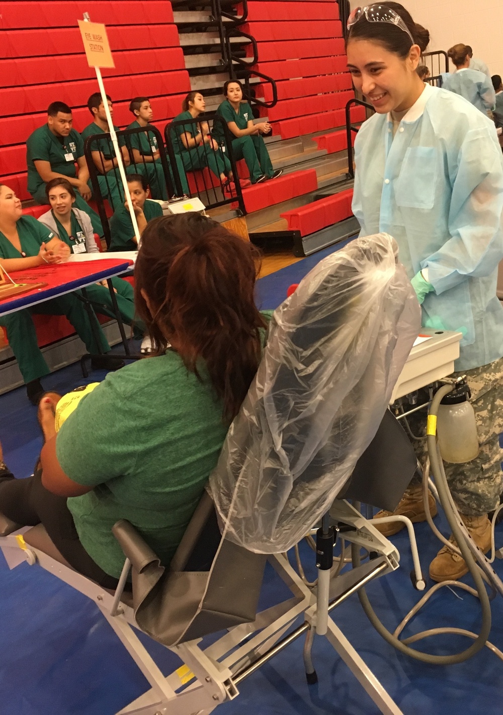 Army Reserve Soldier bonds with dental patient during Operation Lone Star