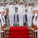 Sailors stand at attendion during the national anthem at the USS Topeka change of command