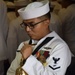 USS Topeka Sailor rings the bell during the submarine's change of command ceremony