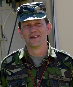 Romanian doctor proud to serve with U.S. and others