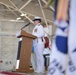 Capt. Carola J. List reads her orders assuming command of Coast Guard Air Station Sacramento