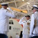 Capt. Carola J. List and Capt. Douglas E. Nash salute during a change of command ceremony