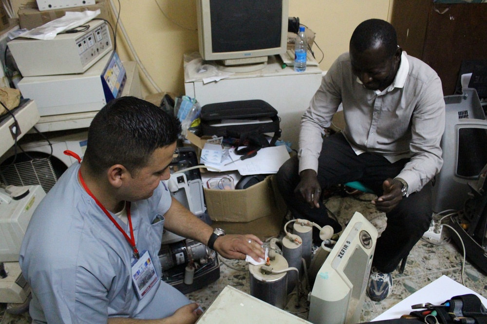 Chad Army and US Army Reserve biomedical equipment technicians partner efforts in Chad hospital